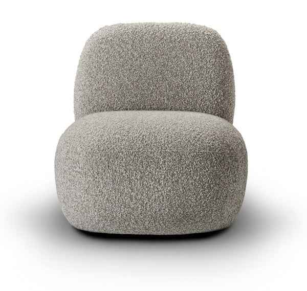 Angled view of Havana Lounge Chair by Eilersen in beige boucle, showcasing its plush, minimalist form.