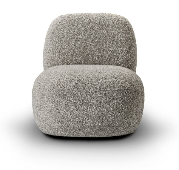 Angled view of Havana Lounge Chair by Eilersen in beige boucle, showcasing its plush, minimalist form.