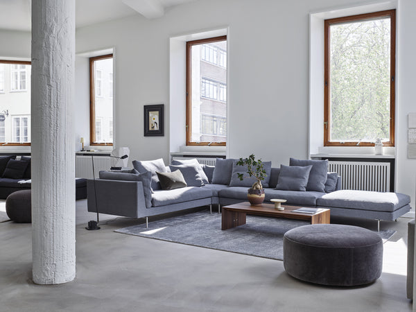 Float High Sectional Sofa by Eilersen in a light grey fabric, styled in a bright living space with contemporary furniture and decor.