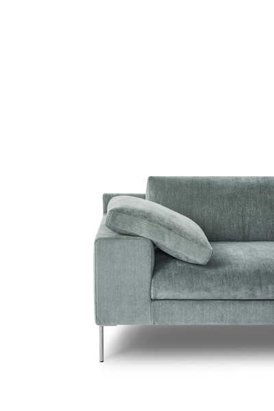 Close-up of Shu Sofa by Eilersen highlighting its structured armrest and premium blue upholstery, perfect for upscale furniture collections.