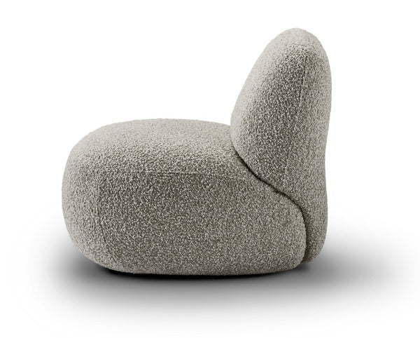 Spacious living room with Havana Round Arm Chairs by Eilersen in white and blue, styled with a low wood coffee table.