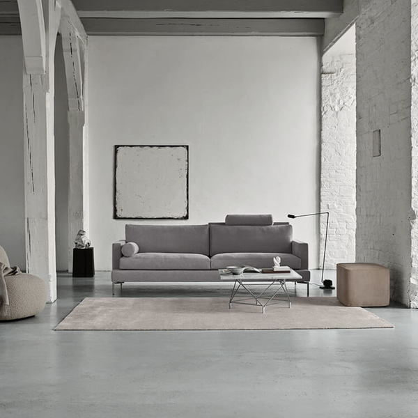 The Great Lift Sofa by Eilersen at Trade Source Furniture in a minimalist white room, paired with a modern rug and accent furniture.