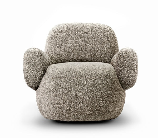 Angled view of Havana Round Arm Chair by Eilersen in beige boucle, showing its soft curves and contemporary design.