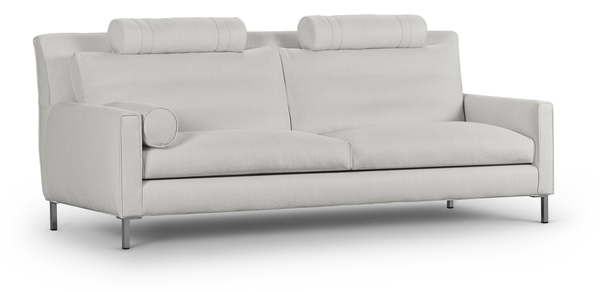 Front angled view of the Streamline High Back Sofa by Eilersen in light fabric, showcasing its minimalist design and adjustable headrests.