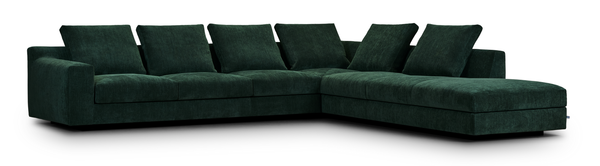 Studio shot of the Aton Mini Sofa by Eilersen in green upholstery, highlighting its L-shape and modern silhouette. Premium compact sofa for contemporary homes.