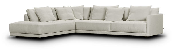 Studio image of the Drop Sectional Sofa by Eilersen in cream fabric, showcasing its deep seats and modular L-shape layout.