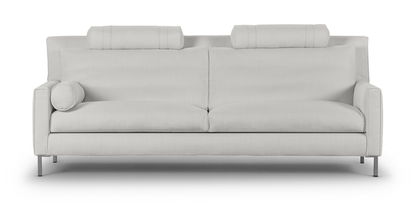 Front view of the Streamline High Back Sofa by Eilersen in cream with dual back cushions and cylindrical headrests for ergonomic support.
