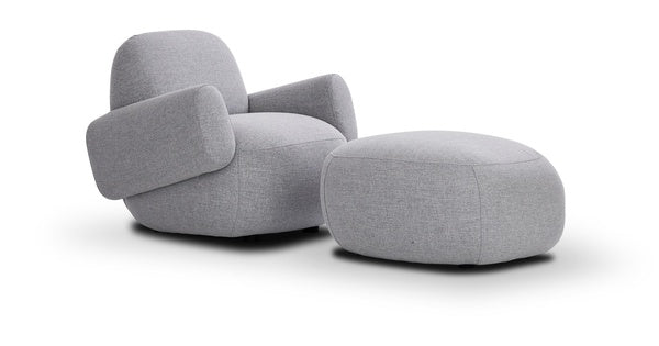 Elegant interior with Havana Round Arm Chair by Eilersen in dark boucle, styled with a floor lamp and neutral furnishings.