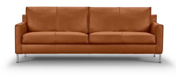 Front view of the Streamline Sofa by Eilersen at Trade Source Furniture in cognac leather, featuring structured cushions and modern silhouette.