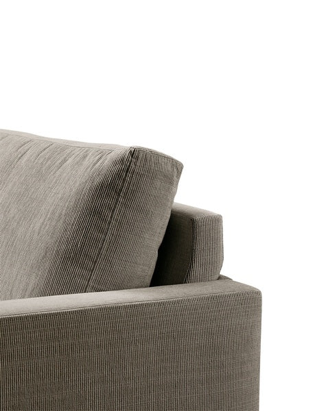 Detail of the Quick Ship Lift Sofa by Eilersen back cushion in ribbed beige fabric, emphasizing craftsmanship and comfort.
