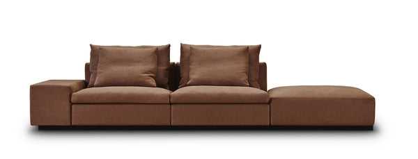 Three-piece Dacapo Sofa by Eilersen with attached bumper in brown fabric, offering versatile seating options, featured at Trade Source Furniture.