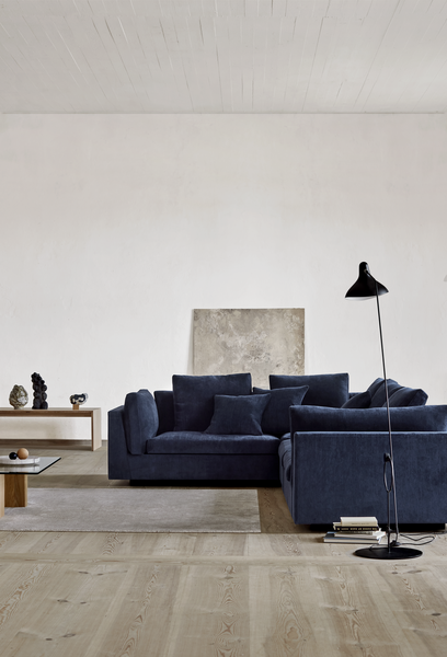Navy blue Float Sofa sectional by Eilersen in a bright, minimalist room. Available at Trade Source Furniture in custom configurations.