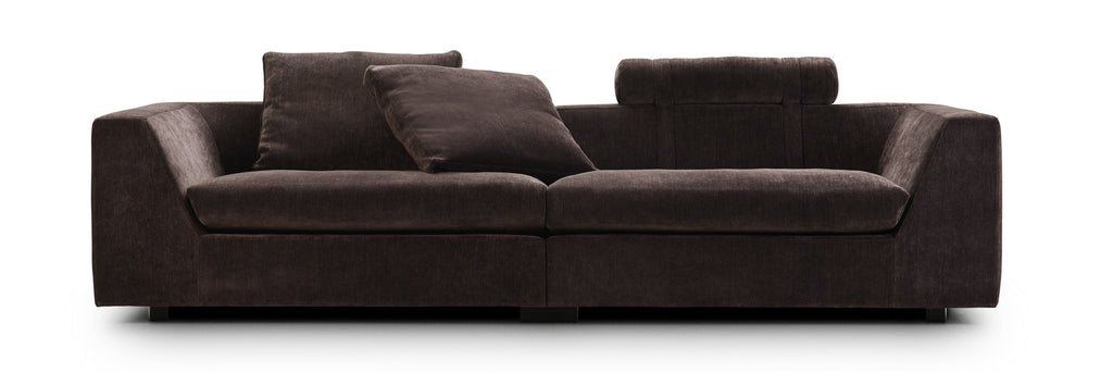 Chess Sofa by Eilersen in light beige L-shaped configuration with plush cushions and headrest, ideal for open living spaces.