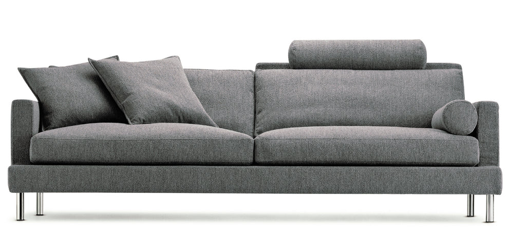 The Great Lift Sofa by Eilersen at Trade Source Furniture in dark gray fabric, styled with plush cushions and a cylindrical bolster.