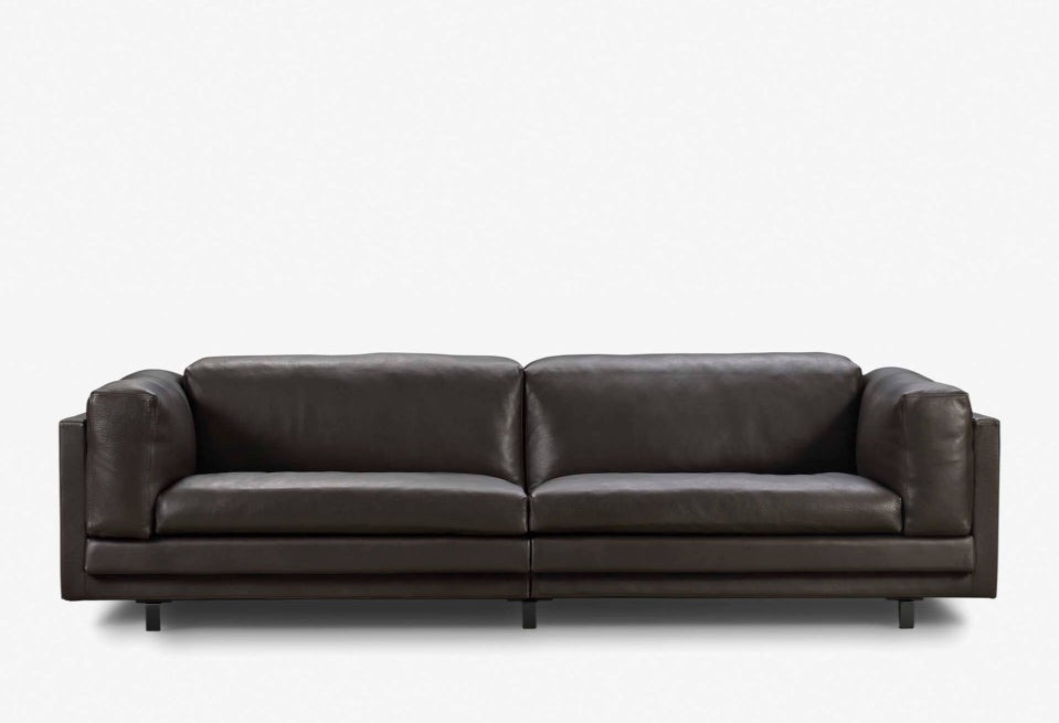 Dark brown leather Tub Sofa by Eilersen, front view showing plush cushions and sleek profile at Trade Source Furniture.