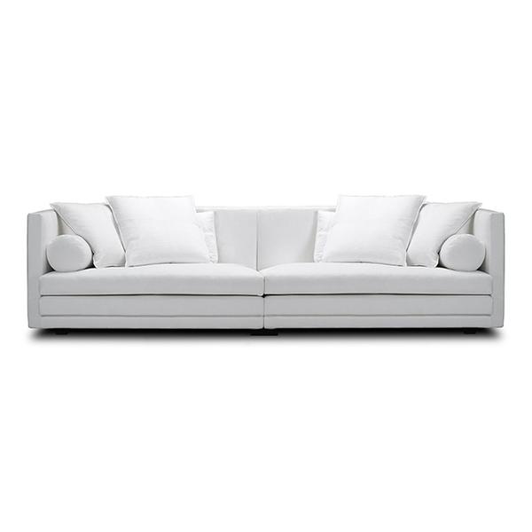 Front view of Cocoon Sofa by Eilersen at Trade Source Furniture in white fabric, showcasing symmetrical design with bolster and square cushions.
