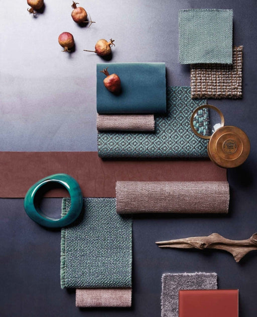 Color palette featuring trending interior colors for 2024, including teal, earthy browns, muted greens, and textured fabric samples for modern home decor.