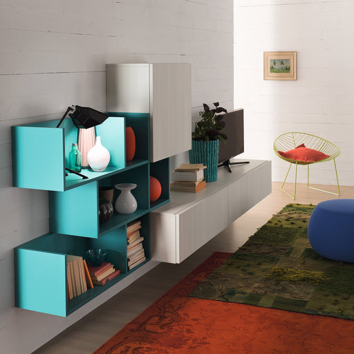 A modern living room with white wooden wall panels, a vibrant turquoise bookshelf with decorative vases, a flat-screen TV, a green potted plant, colorful rugs, and a stylish yellow wire chair with a red cushion.