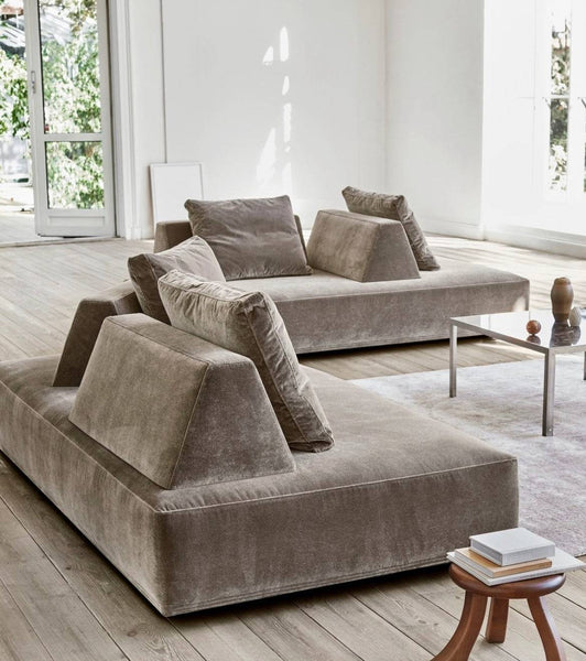 Eilersen Playground Sofa: A modern, modular seating solution featuring flexible, movable backrests and premium fabric upholstery, designed to offer customizable comfort and a minimalist aesthetic for contemporary living spaces.