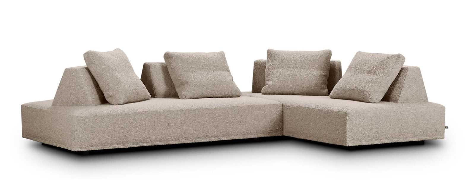 Beige sectional sofa with cushions on a white background