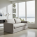 Gray sofa in a modern living room with large windows overlooking a scenic view.