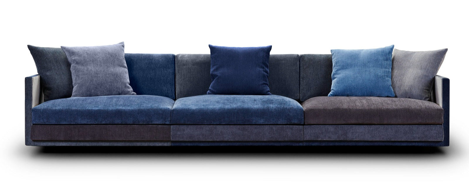Modern sofa with blue and gray cushions on a white background
